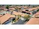 Neighborhood aerial view showcasing many homes featuring tile roofs and solar panels at 5043 Mascaro Dr, Las Vegas, NV 89122