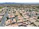 An aerial view of a well maintained community featuring a pool and a desert landscape at 5043 Mascaro Dr, Las Vegas, NV 89122