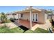 Charming backyard patio with pergola, low maintenance landscaping, and private access doors at 5043 Mascaro Dr, Las Vegas, NV 89122