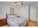 This bedroom features wood floors, a ceiling fan and natural light at 5043 Mascaro Dr, Las Vegas, NV 89122