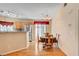 Cozy dining area features hardwood floors and modern chandelier lighting at 5043 Mascaro Dr, Las Vegas, NV 89122