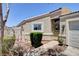 Inviting single-story home with a desert landscape and manicured front yard at 5043 Mascaro Dr, Las Vegas, NV 89122