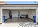 Spacious garage with an automatic door opener, storage racks, and ample workspace at 5043 Mascaro Dr, Las Vegas, NV 89122