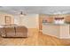 Open-concept living room with wood-look floors seamlessly connecting to the kitchen at 5043 Mascaro Dr, Las Vegas, NV 89122