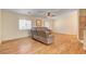 Bright living room with wood-look floors, a comfortable sofa, and ample natural light at 5043 Mascaro Dr, Las Vegas, NV 89122