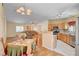 Open concept kitchen and living room area with hardwood floors and stainless appliances at 5043 Mascaro Dr, Las Vegas, NV 89122