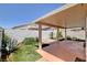 Inviting covered patio with landscaping, stone accents and a privacy wall for outdoor enjoyment at 5043 Mascaro Dr, Las Vegas, NV 89122