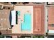 Overhead view of a community pool with a unique shape, sunbathing spots, seating, and a covered structure at 5043 Mascaro Dr, Las Vegas, NV 89122