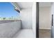 Outdoor balcony overlooking a neighborhood with lush trees and a sunny sky at 5191 Caliente St # 84, Las Vegas, NV 89119