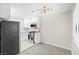 Spacious kitchen with white cabinets, stainless steel appliances, quartz countertop and gas range at 5191 Caliente St # 84, Las Vegas, NV 89119