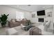 Cozy living room featuring a fireplace, two armchairs, a sofa and a glass table with decorations at 5191 Caliente St # 84, Las Vegas, NV 89119