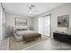 Bright, spacious main bedroom featuring a modern design with large windows and a ceiling fan at 5191 Caliente St # 84, Las Vegas, NV 89119