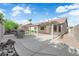 Large backyard featuring a covered patio, built-in BBQ area, and ample space for outdoor entertaining at 5437 Escallonia St, Las Vegas, NV 89149