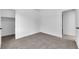 Well lit carpeted bedroom showcasing walk-in closet and light gray paint at 5437 Escallonia St, Las Vegas, NV 89149
