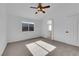 Cozy bedroom with carpet flooring, ceiling fan, and plenty of natural light at 5437 Escallonia St, Las Vegas, NV 89149