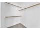 Walk-in closet with built in shelving and gray carpet at 5437 Escallonia St, Las Vegas, NV 89149