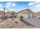 Attractive single-story home, xeriscaped front yard, and a two-car garage; perfect for desert living at 5437 Escallonia St, Las Vegas, NV 89149