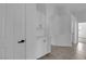 Bright hallway featuring custom built-in cabinets, tile flooring, and crisp white walls and trim at 5437 Escallonia St, Las Vegas, NV 89149