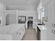 Modern kitchen with stainless steel appliances, white cabinets, and a large center island perfect for cooking at 5437 Escallonia St, Las Vegas, NV 89149