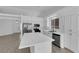 Spacious kitchen features a large center island, ample storage, stainless appliances, and adjacent dining area at 5437 Escallonia St, Las Vegas, NV 89149