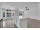 Bright and airy kitchen featuring tile flooring, a center island, and a spacious dining area at 5437 Escallonia St, Las Vegas, NV 89149