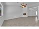 Open-concept living space with tile floors and a fireplace, offering plenty of natural light at 5437 Escallonia St, Las Vegas, NV 89149