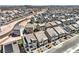 Wide aerial shot showcases a thriving community with many homes in neat rows and desert landscaping at 5904 Becklow Gardens Ave, Las Vegas, NV 89141
