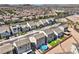 An aerial view of the neighborhood showcasing backyard pools, astroturf landscaping, and contemporary two story home styles at 5904 Becklow Gardens Ave, Las Vegas, NV 89141