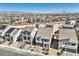 Scenic aerial view of a residential area featuring modern homes with desert landscaping and mountain views at 5904 Becklow Gardens Ave, Las Vegas, NV 89141