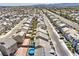 An aerial view of the community showcasing uniform backyard astroturf and water features at 5904 Becklow Gardens Ave, Las Vegas, NV 89141