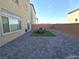 The paved backyard offers a serene outdoor living area, complemented by privacy walls at 5904 Becklow Gardens Ave, Las Vegas, NV 89141