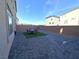 Backyard includes paved stones and minimal lawn at 5904 Becklow Gardens Ave, Las Vegas, NV 89141
