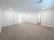 This bedroom features neutral walls, plush carpet, recessed lights, and two entry doorways at 5904 Becklow Gardens Ave, Las Vegas, NV 89141