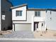 Charming two-story home featuring a modern design, two car garage and a landscaped front yard at 5904 Becklow Gardens Ave, Las Vegas, NV 89141