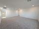 Spacious, carpeted living room with neutral walls, offering a versatile layout at 5904 Becklow Gardens Ave, Las Vegas, NV 89141