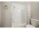 Bright bathroom featuring a shower and bathtub with white tile and a modern shower head at 595 Sellers Pl, Henderson, NV 89011