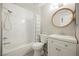 Updated bathroom with modern fixtures, white vanity, and shower-tub combo at 595 Sellers Pl, Henderson, NV 89011