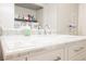 Close up of a bathroom marble countertop, faucet, and cabinet hardware at 595 Sellers Pl, Henderson, NV 89011