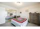 Cozy bedroom with carpet, featuring a mirrored closet and neutral decor at 595 Sellers Pl, Henderson, NV 89011