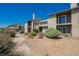 Condo complex featuring private balconies and desert landscaping, offering a serene outdoor environment at 595 Sellers Pl, Henderson, NV 89011
