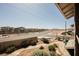 Neighborhood street view with landscaped yards and mountains in the distance as viewed from a balcony at 595 Sellers Pl, Henderson, NV 89011