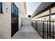 Exterior of an apartment complex featuring a security gate and a stucco wall at 595 Sellers Pl, Henderson, NV 89011