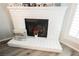 White brick fireplace with decor, perfect for cozy evenings in this home at 595 Sellers Pl, Henderson, NV 89011