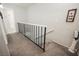 Upstairs hallway featuring carpet and a black metal railing and white railing at 595 Sellers Pl, Henderson, NV 89011