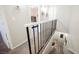 Second floor hallway with view of the staircase, featuring neutral carpeting and white walls at 595 Sellers Pl, Henderson, NV 89011