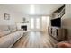 Open living room featuring a fireplace, modern flooring, and neutral wall colors at 595 Sellers Pl, Henderson, NV 89011