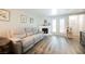 Inviting living room with cozy fireplace, plush sofa, and wood-look flooring at 595 Sellers Pl, Henderson, NV 89011