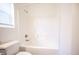 Bathroom featuring a tub with tile surround and updated fixtures at 6029 Allanche Ave, Las Vegas, NV 89141