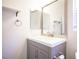 Modern bathroom featuring a vanity with a square sink and chrome fixtures at 6029 Allanche Ave, Las Vegas, NV 89141