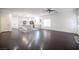 Spacious open-concept living room featuring hardwood floors and white trim at 6029 Allanche Ave, Las Vegas, NV 89141
